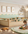 Toddler room with full size floor platform bed for toddlers with full length guardrails on three sides. Low profile natural wood finish.