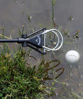 Water Golf Ball Retriever Telescoping to 15 Feet with Ergonomic Grip Handle retrieving ball from water hazard