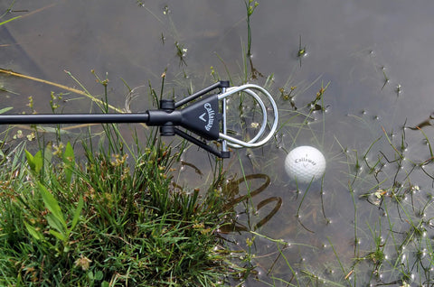 Water Golf Ball Retriever Telescoping to 15 Feet with Ergonomic Grip Handle retrieving ball from water hazard