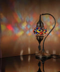 Totally Handmade Turkish Moroccan Swan Neck Tiffany Style Mosaic Glass Table Lamp With Colorful Hand Cut Glass Globes For Bedroom Living Room Desk And Bedside Lighting Made In Turkey, emitting colorful light patterns on wall.