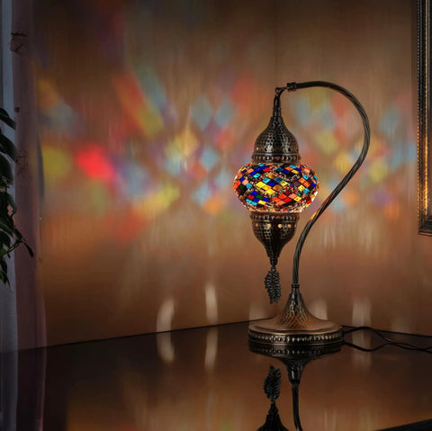 Totally Handmade Turkish Moroccan Swan Neck Tiffany Style Mosaic Glass Table Lamp With Colorful Hand Cut Glass Globes For Bedroom Living Room Desk And Bedside Lighting Made In Turkey, emitting colorful light patterns on wall.