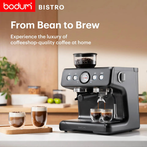 Premium Game Changer Electric Espresso Machine With Integrated Stainless Steel Burr Grinder And High Pressure Milk Frother Steam Wand For Straight Up Barista Style Brewing At Home In Classic Black on kitchen counter, brewing espresso.