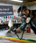 Man wearing Full Face Reusable Respirator Mask With A1 Organic Vapor Filters And P2 Dust Filters for painting in a workshop.