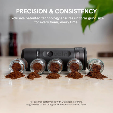 Fino Portable Electric Coffee Grinder With 28 Grind Settings For Espresso To French Press next to ground coffee samples on a counter
