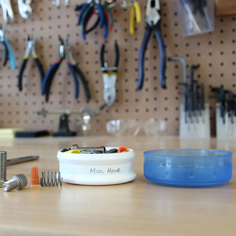 GoTubb Mini Storage Containers For Snacks And Grab And Go Travel Gear With One Hand Snap Lid, clear container in workshop