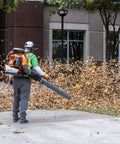 Person using Beast Gas Backpack Leaf Blower With 75.6cc 4.59-HP 2-Cycle Power, 1000 CFM Air Volume, 220 MPH Blowing Speed, 47 N in park