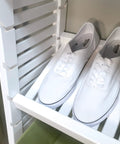 Heavy Duty Solid Wood Closet Storage Rack With Wide Shelves And Hanging Rods Straight Up Kickin Up Your Reach In Space Cut To Fit Any Pantry Or Laundry Closet White displaying white shoes on a shelf.