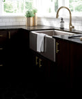 Modern kitchen with Satin Gold Cabinet Handles Set 30 Pack with Three Inch Center Holes installed on dark wood cabinets