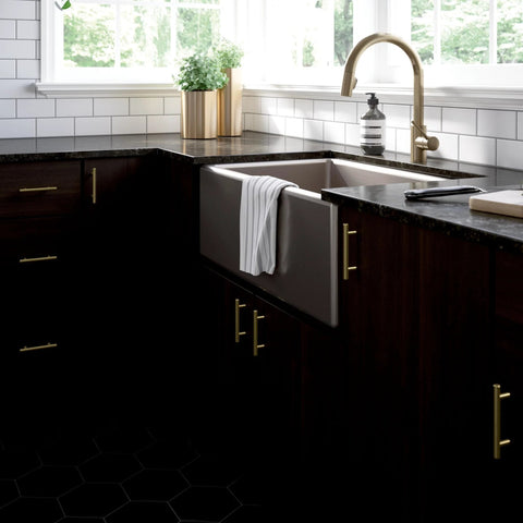 Modern kitchen with Satin Gold Cabinet Handles Set 30 Pack with Three Inch Center Holes installed on dark wood cabinets