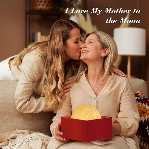 Two women sharing a moment with a Large Moon Lamp 7.1-Inch With Wooden Base, Touch Dimmable Dual Color Night Light gift in box.