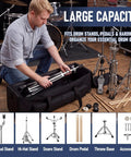 Man organizing drum hardware in Badass 32 Inch Rolling Drum Hardware Duffle Bag With Smooth Wheels And Slamming Padding.