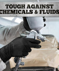 Close-up of hands wearing black nitrile gloves holding a paint spray gun