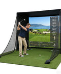 Man using All In One Golf Simulator Enclosure Kit With Pro Grade HD Impact Screen, foam padded frame, blackout curtains in home setup