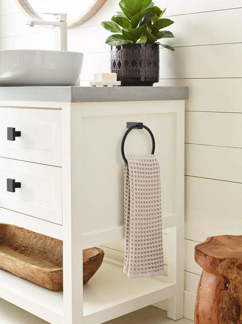 Towel Ring In Monument Matte Black, Six And A Half Inch Bath Hardware Upgrade with beige towel in modern bathroom