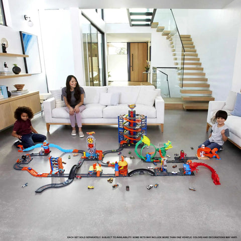 Children playing with BHT77 Diecast Car And Track Pack in Orange Includes Car And Track Pieces For Action Packed Play