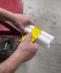 Person wrapping pipes with Multi-Purpose Duct Tape 3900 Yellow: General Purpose Rubber Adhesive, Water Resistant Cloth-Backed