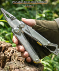 Hand holding 17 In 1 Multitool Pliers With Flint Fire Starter And Carabiner Hammer, 5Cr13 Steel Outdoor EDC Gear in the woods