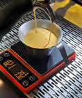Compact Portable Coffee Scale With Timer 3kg 0.1g High Precision Espresso Scale in use with espresso cup on top, orange.