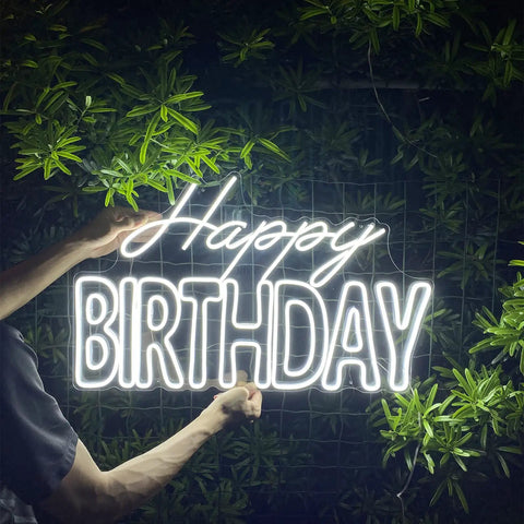 Big Birthday Neon Sign For Wall Decor With Dimmer Switch, 12V Reusable Light Up Birthday Party Decoration, held outdoors against greenery