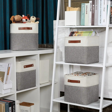 11 Inch Cube Storage Bins Set Of 4 With PU Leather Handles neatly placed on white shelves in a living room setting