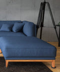 Reusable Furniture Sliders for Carpet 3.5 Inch Round Heavy Duty Floor Protectors under a blue sofa and ottoman on carpet
