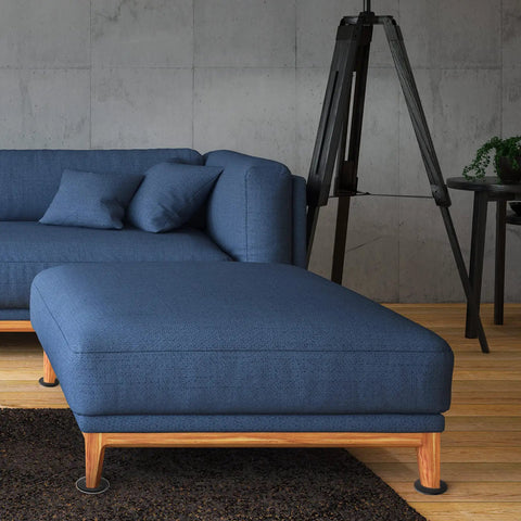 Reusable Furniture Sliders for Carpet 3.5 Inch Round Heavy Duty Floor Protectors under a blue sofa and ottoman on carpet