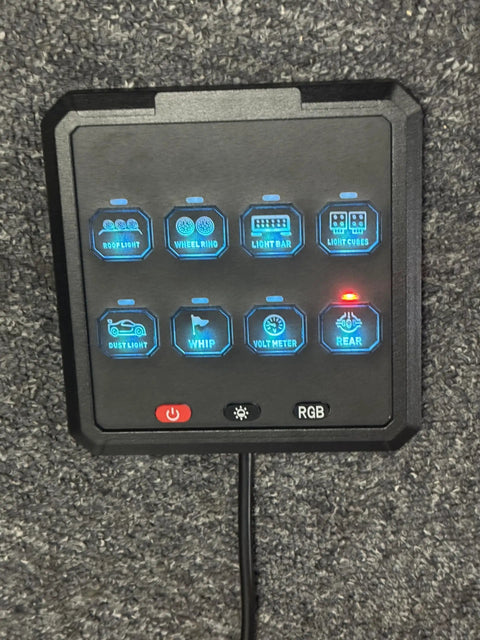 Front view of 8 Gang Electronic Switch Panel For 12V Systems With Led Indicators And Remote Control on dark surface