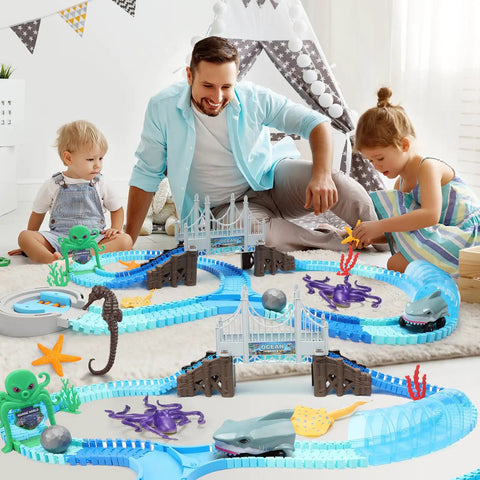 Family playing with Shark Race Track Set With Bendable Cars For Kids Aged 3 To 9, 183 Piece Ocean Themed STEM Playset on carpet