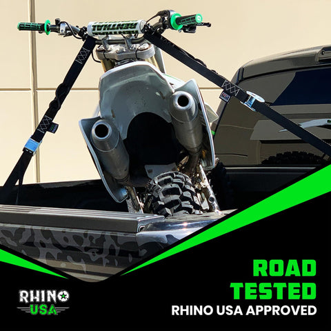 Motorcycle secured with Two Pack Motorcycle Tie Down Straps With 2200 Pound Break Strength Steel Cam Buckles Integrated Soft Loops
