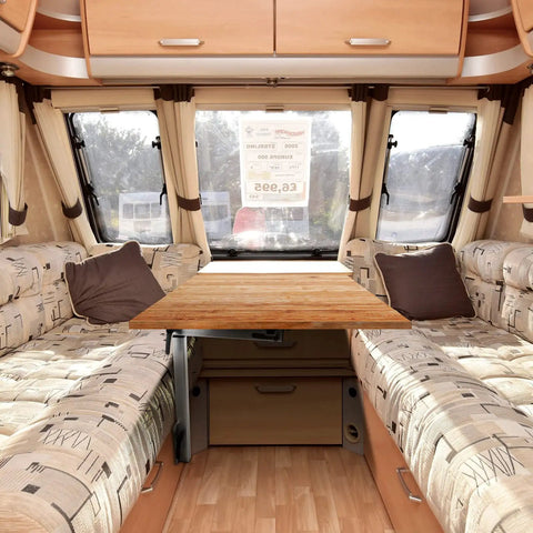 Interior of caravan featuring installed Removable RV Table Base Mount With 360 Degree Rotation Desk Leg for easy conversion.