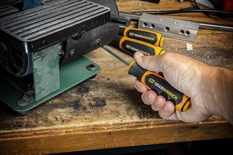 Hand using 20 Piece Phillips Slotted And Torx Screwdriver Set With Dual Material Handles And Speed Zone Grip For Faster Turns