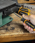 Hand using 12 Piece Phillips And Slotted Screwdriver Set With Speed Zone Handle Pro Grade Dual Material Grips And Non Slip Black Oxide Tips