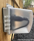 Image of 1-Gang Weatherproof Outdoor Outlet with Extra Deep 5 1/4 Inch Lockable Cover, installed on wooden fence, side view.