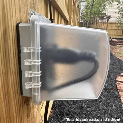 Image of 1-Gang Weatherproof Outdoor Outlet with Extra Deep 5 1/4 Inch Lockable Cover, installed on wooden fence, side view.