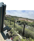 Black Heavy Duty Deck Railing System With Wall Mount Balcony Fencing And Snap On Infill Panel Kit showing sturdy corner post with view.