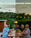 Outdoor Solar String Lights 29 Ft Long With 10 S14 Edison Bulbs Warm White IP65 Waterproof over a family dinner at dusk.