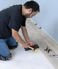No Nonsense Foam Underlayment Roll Quiet Room Padding For Laminate And Engineered Wood Flooring installation in progress.