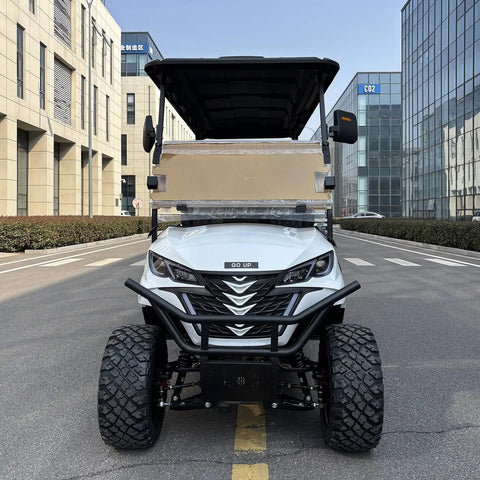 Front view of Six Seater Electric Leisure Cart With Premium Upholstered Interior And Beefy All Terrain Tires on a street.