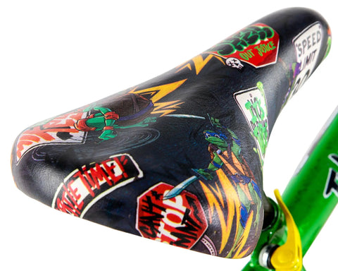 Close-up of Teenage Mutant Ninja Turtles 16 Inch BMX Bike seat with vibrant graphics for kids ages 5 to 7.