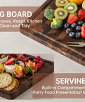 Top Shelf Solid Walnut End Grain Cutting Board Heavy Duty Kitchen Prep Surface With Deep Juice Channels 17X13X1 Inch displaying fruits and snacks.