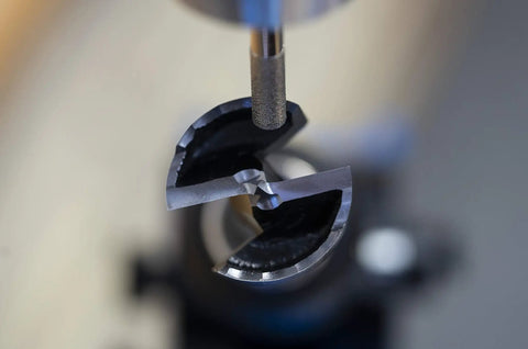 Pro Grade Forstner And Hinge Boring Bit Sharpener showing a finely sharpened drill bit ready for use.
