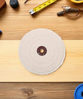 Two Pieces Of Versatile Cotton Polishing Buffing Wheels For Fast Bench Grinder Work That Delivers A Blinding Mirror Finish On Wood Metal And Stone Surfaces Every Single Time on a wooden surface with tools.