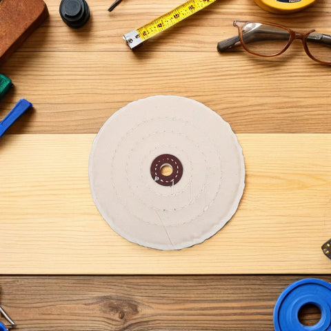 Two Pieces Of Versatile Cotton Polishing Buffing Wheels For Fast Bench Grinder Work That Delivers A Blinding Mirror Finish On Wood Metal And Stone Surfaces Every Single Time on a wooden surface with tools.