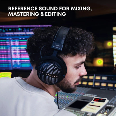 DT 1990 Pro MKII Open-Back Wired Studio Headphones For Mixing And Mastering worn by audio engineer in studio.