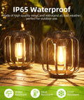 Outdoor Solar Lanterns Pack Of 4 Waterproof Metal Hanging Lights with Hooks glowing warmly under rain on a deck.