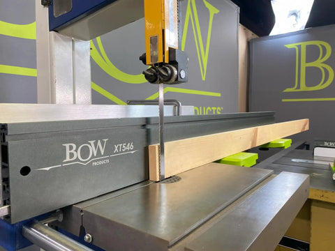 Premium 46 Inch T Track Table Saw Fence Extension With A Bold Five Inch Tall Face attached to bandsaw with wood guide.