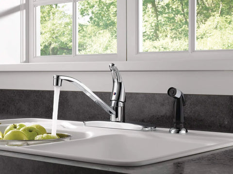 Single Handle Kitchen Sink Faucet With Side Sprayer Chrome Finish 360 Degree Swivel Fits Four Hole Eight Inch Setup shown in kitchen sink.