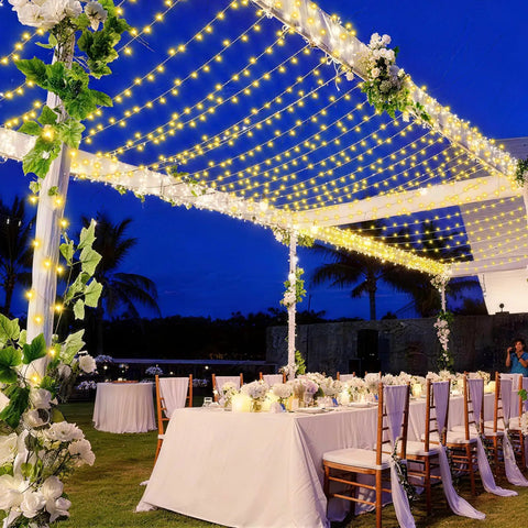 Outdoor wedding setup with tables under 1000 LED Christmas String Lights Outdoor 403 Ft With 8 Lighting Modes IP44 Waterproof Fairy Lights.