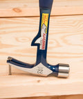 HammerTooth 22 Oz Rip Claw Hammer USA Made Smooth Face Shock Reduction Grip resting on wood surface