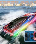 Brushless Remote Control RC Boat With LED Lights For Kids And Grownups 25 KMH 2 4GHz Racing Speed Boat Includes Two Batteries Capsize Recovery 180 Degree Stability For Pool And Lake Play Red shown sailing with anti-tangling propeller design